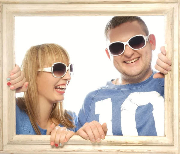 Loving couple in picture frame. — Stock Photo, Image