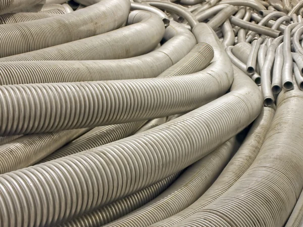 Flexible metal hose in a warehouse. — Stock Photo, Image