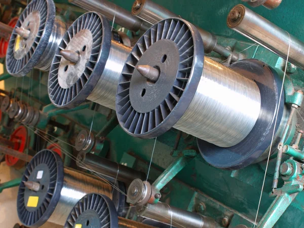 Steel wire spools.Braiding machine. — Stock Photo, Image