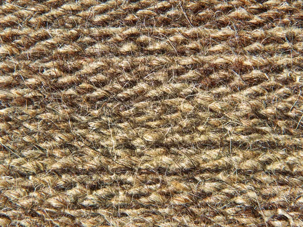 Ruvida maglia tessuto di lana di cammello texture presa primo piano . — Foto Stock