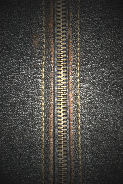 Metal zipper on a black leather taken closeup. — Stock Photo, Image