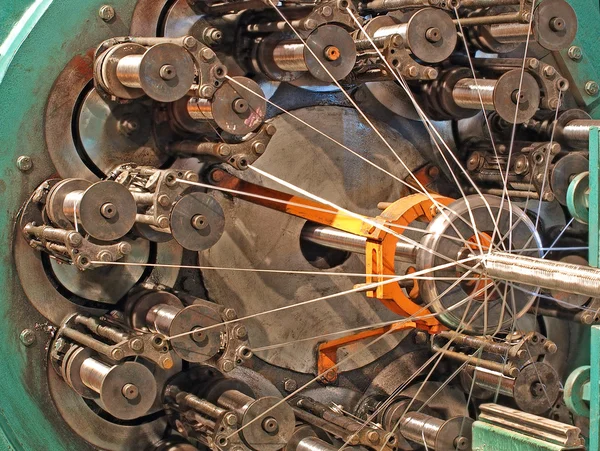 Flexible metal hose braiding machine taken closeup. — Stock Photo, Image