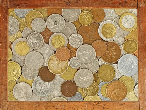 Old wooden frame with numismatic coins collection inside.Backgro — Stock Photo, Image