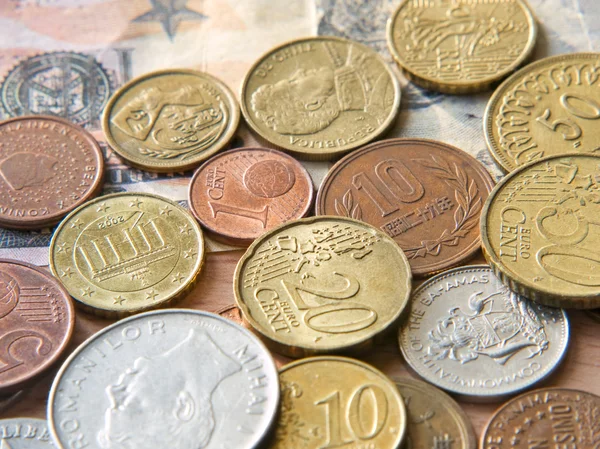 Different coins and dollar bill taken closeup. — Stock Photo, Image