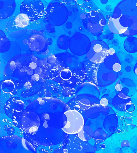 Blå och turkosa bubbla bokeh abstrakt bakgrund. — Stockfoto