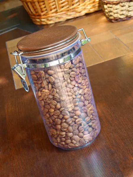 Coffee beans in glass container. — Stock Photo, Image