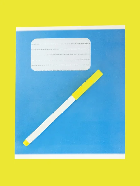 Blue writing book on a yellow background. — Stock Photo, Image