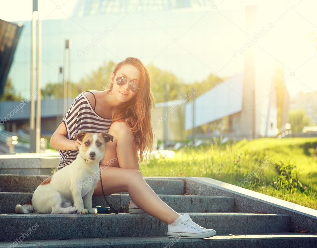 Trendy Hipster Girl with her Dog in the City