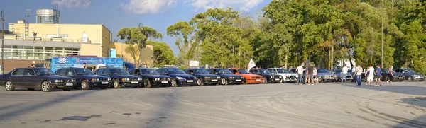 Fans of BMW cars lined up the parade on the square. August 2014