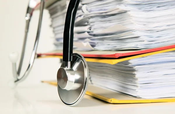 Stethoscope is lying on papers — Stock Photo, Image