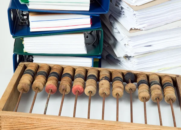 Mathematical calculator abacus with papers — Stock Photo, Image