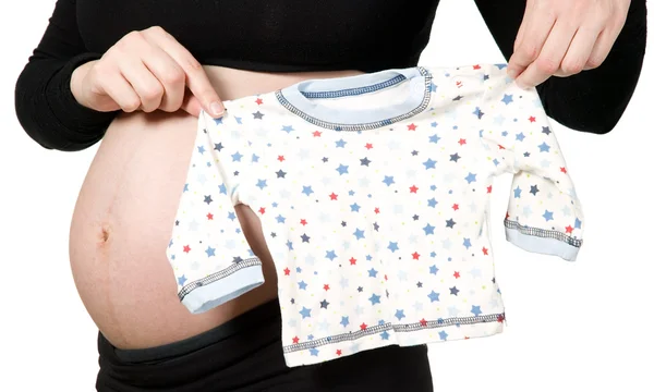 Woman hands holding baby T-shirt — Stock Photo, Image