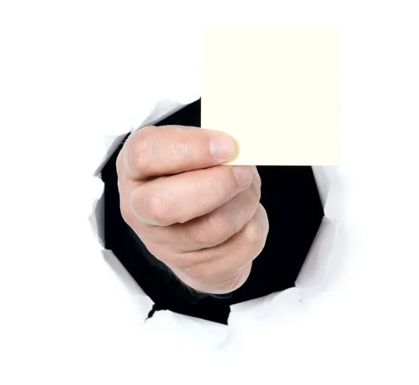 Man is showing blank card through a hole — Stock Photo, Image