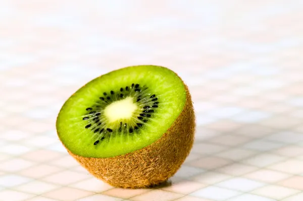 Green cutout fruit kiwi on the table — Stock Photo, Image