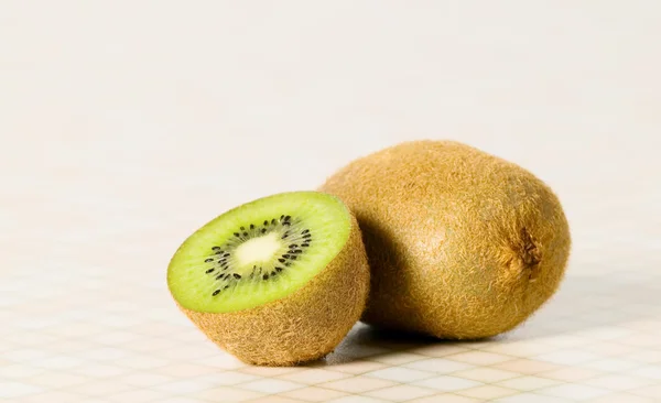 Green cutout fruit kiwi on the table — Stock Photo, Image