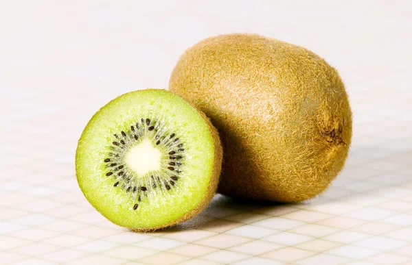 Green cutout fruit kiwi on the table — Stock Photo, Image