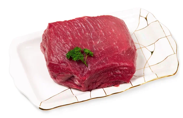 Сире нарізане м'ясо на тарілці — стокове фото