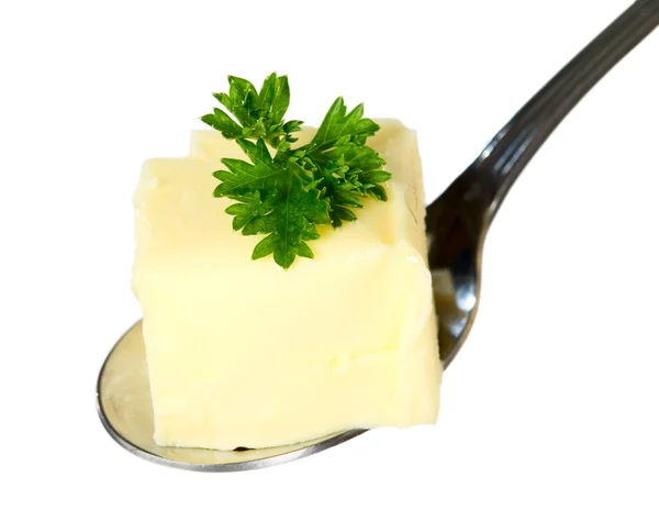 Yellow butter with spoon — Stock Photo, Image