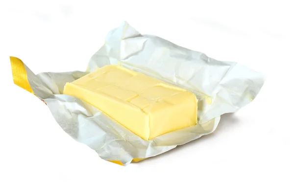 Mantequilla amarilla con paquete de papel Fotos De Stock