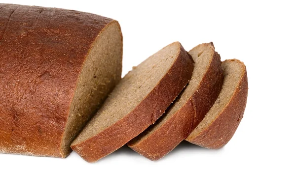 Dark bread with some sliced pieces — Stock Photo, Image