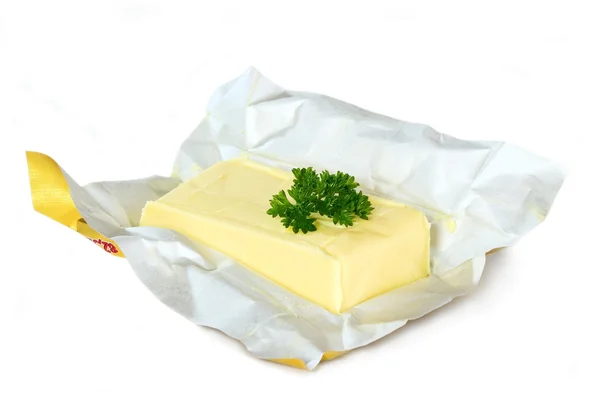 Burro giallo con pacchetto di carta — Foto Stock