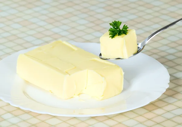 Żółty masło z łyżką — Zdjęcie stockowe