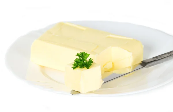 Yellow butter with knife — Stock Photo, Image