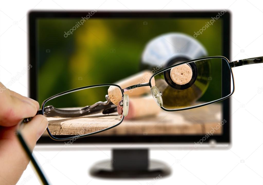 Man is viewing to wine bottle on display