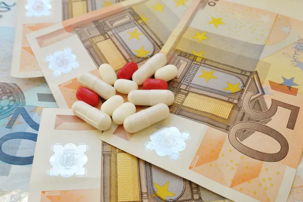 Χρήματα και χάπια — Φωτογραφία Αρχείου