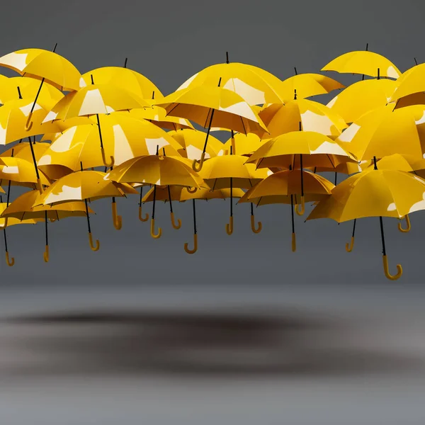 Crowd of yellow umbrellas no people on gray background with copy space. Autumn symbol. Fall bold colors. 3D rendering.