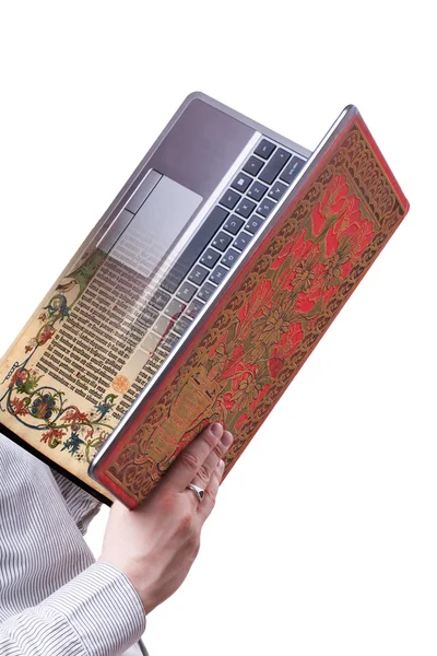 Handen met laptop als papieren boek geïsoleerd op witte achtergrond — Stockfoto