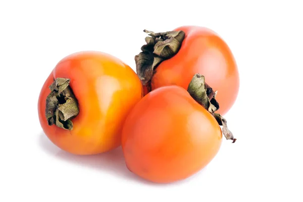 3 dojrzałe persimmons na białym tle — Zdjęcie stockowe