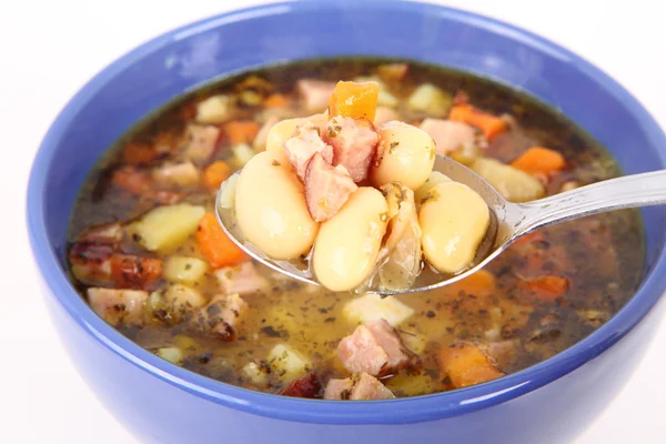 Bean soup eaten with a spoon — Stock Photo, Image
