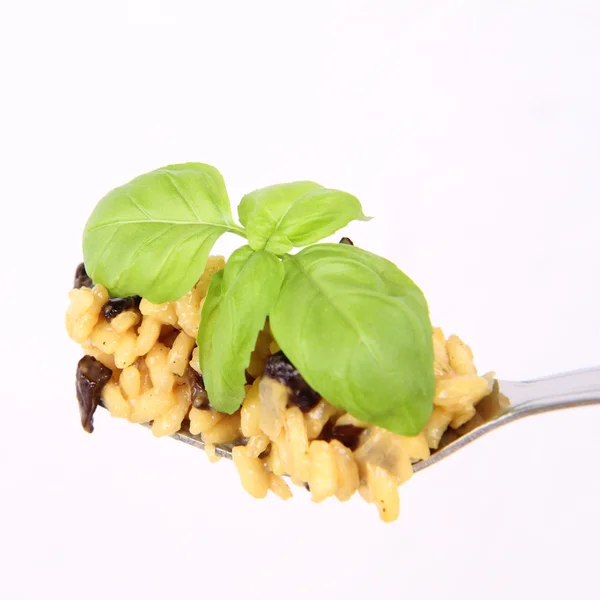 Risotto with mushrooms on a fork — Stock Photo, Image