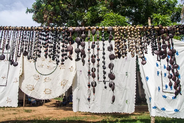 Crafts embroidered tablecloths and necklaces seed — Stock Photo, Image