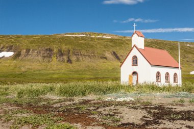 White wooden church in Unadsdalur Village - Iceland. clipart