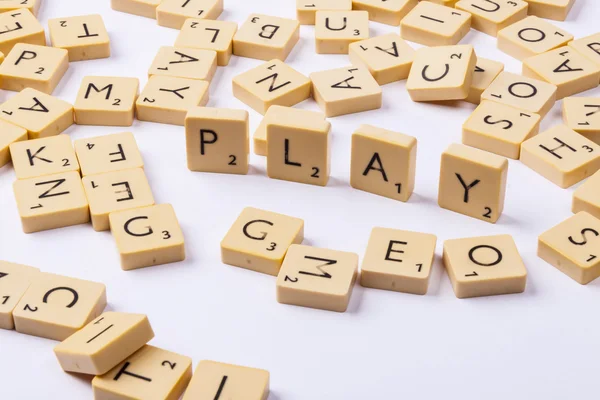 Play word and letters on white background. — Stock Photo, Image