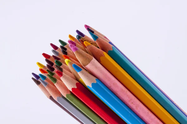 Colourful wooden crayons on white background. — Stock Photo, Image