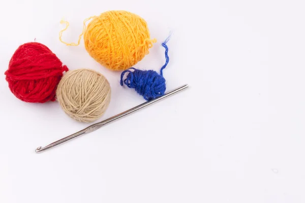 Crochet hook and wool - white background. — Stock Photo, Image