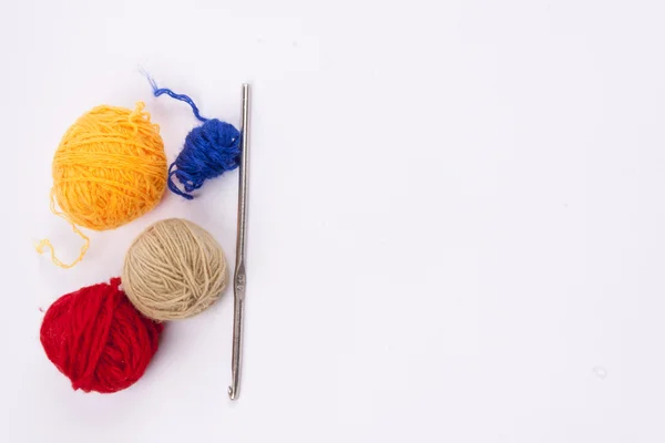 Crochet hook and wool - white background. — Stock Photo, Image