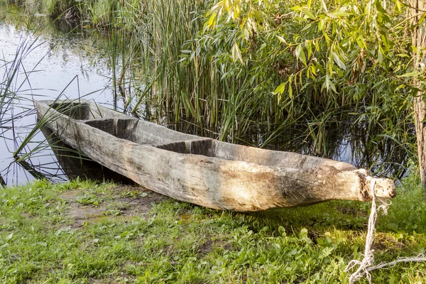 Old wooden canoe in Biskupin Museum - Poland. — Stock Photo, Image