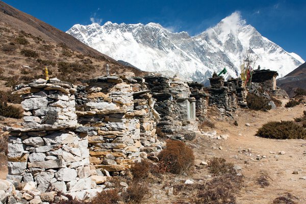 Buddhist prayer walls or prayer stupas in nepal on the way to everest base camp