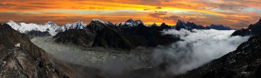 panoramic view of Everest, Lhotse, Cho Oyu and Ngozumba glacier clipart