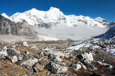 hungchhi peak and Chumbu peak above Ngozumba glacier from Cho Oyu base camp - trek to Everest base camp - Nepal clipart