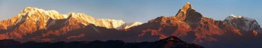 Evening, sunset view of mount Annapurna and Machapuchare or Machhapuchhare, Nepal Himalayas mountains clipart