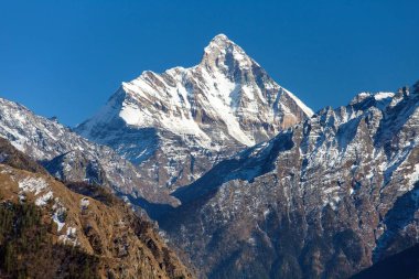 mount Nanda Devi, one of the best mounts in Indian Himalaya, seen from Joshimath Auli,  Uttarakhand, India clipart