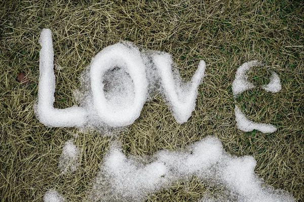 Love. Message made of snow. — Stock Photo, Image