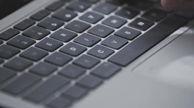 Close up of a young man hand busy typing. 