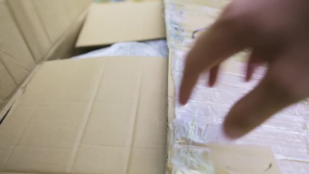 Close View Caucasian Man Opening Brown Cardboard Box Wrapped Plastic — Stok Video