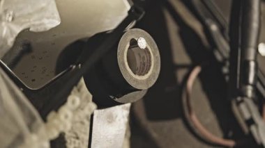 Caucasian male hand is taking the tape from the hook in the garage. Concept of looking for things. Steady high quality 4K dolly footage.